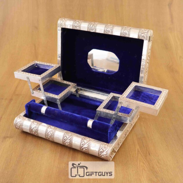 Luxury multi-tier golden jewellery box with mirror and red velvet finish.